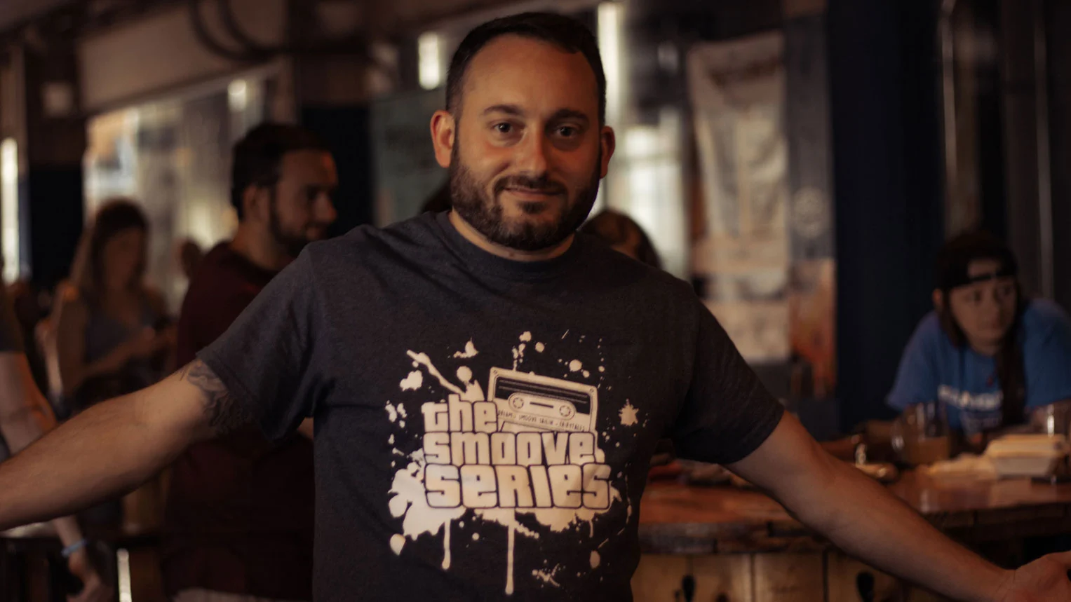 A fan wearing in Smoove Series band merchandise