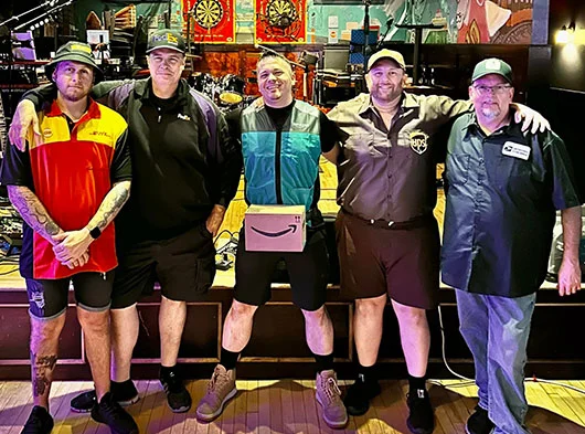 Smoove Series dressed up like various delivery company employees for Halloween Show in 2023 at The Blind Rhino in South Norwalk, CT