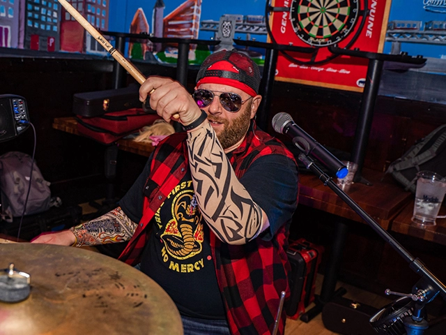 Joe Saad playing at a brewery